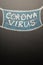 A drawn mask on a blackboard with the inscription Coronavirus. News headline, articles. Epidemic and pandemic, problems in