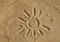 Drawn on sand picture of sun
