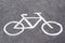 Drawn symbol bicycle on asphalt bike.