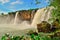 Dray Nour waterfall, against the blue sky, among the green equatorial vegetation, Daklak province, Vietnam