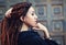 Dreadlocks closeup, fashionable girl posing at old wooden door background