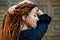 Dreadlocks closeup, fashionable girl posing at old wooden door background