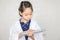 Dream careers concept, Little kid girl doctor typing at wireless computer keyboard, Portrait of Happy child in doctor coat with