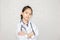 Dream careers concept, Portrait of Happy kid in doctor coat with stethoscope blurred background