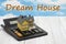 Dream house message with a model house on a calculator