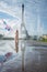 Dream travel - young woman with balloons walking near Eiffel Tower in Paris