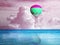 Dream world. Hot air balloon in pink cloudy sky