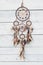 Dreamcatcher, american native amulet on wooden background. Shaman