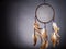 Dreamcatcher on a gray background, with space for an inscription. Cultural Amulet, Indian Culture