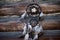 Dreamcatcher on wooden background. spiritual native american magical amulet, tool