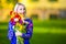 Dreaming Caucasian Blond Embracing Bunch of Colorful Tulips