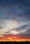 Dreamlike colorful sunset over the city horizon, vertical celestial  background