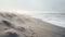 Dreamlike Horizons: Footprints On A Foggy Beach