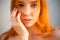 Dreammy gorgeous portrait of redhead woman in soft focus