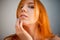 Dreammy gorgeous portrait of redhead woman in soft focus