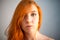 Dreammy portrait of redhead woman in soft focus