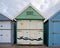 Dreams by the sea beach hut painted with sailing scene
