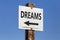 Dreams word and arrow signpost