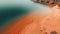 Dreamy Aerial Shot Of Orange Red Sand On Lake