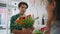 Dreamy african man smell flowers composition. Young man enjoy floral bouquet.