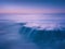 dreamy and beautiful seascape with rock and long exposure on beach