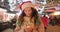 Dreamy beautiful teen girl in santa claus hat with burning candle