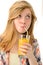 Dreamy blonde girl sipping orange juice