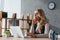 Dreamy businesswoman sitting at table and looking away