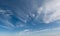 Dreamy clouds float across blue sky panorama