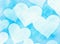 Dreamy frozen light hearts on blue backgrounds