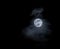 Dreamy full moon on cloudy night