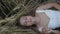 Dreamy girl lying on golden ripe wheat field