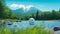 Dreamy Japanese Anime Character Swimming In Water With Mountains