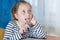 Dreamy little girl sit at desk studying look in distance visualizing or thinking  small child dreamer feel unmotivated distracted