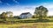 Dreamy Pasture Scene with White Barn