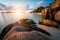 Dreamy sunset at the gorgeous exotic Anse Source d`Argent beach, La Digue island, Seychelles. Long exposure panorama