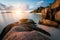 Dreamy sunset at the gorgeous exotic Anse Source d& x27;Argent beach, La Digue island, Seychelles. Long exposure panorama