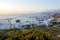 Dreamy sunset over Mykonos town and a traditional windmill, Cyclades, Greece