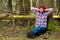 Dreamy and tired bearded forester with an ax