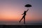 Dreamy view of slim body girl silhouette with umbrella