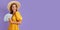 Dreamy wealthy lady hold cash fan look empty space wear yellow dress and straw hat isolated violet color background