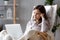 Dreamy woman writer sitting in chair thinking of new idea