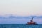 Dredge sand ship working in the sea in blue sky