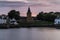 Dreel Halls church surrounded by buildings in Scotland during sunset