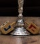 Dreidels and a menorah. Hanukkah. Text-Israel