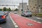 Dresden, Germany - August 17, 2015: Dedicated bike path, Cycling and car traffic, infrastructure of the city.City life.