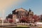 Dresden Semper Opera theatre Semperoper, front view in spring. Blooming branches on foreground.