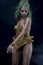 Dress, Latin woman with green hair and gold costume with handmade flourishes, fantasy image and tale