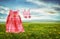 Dress and sandals on clothesline in fields of dandelions