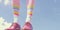 Dress up your feet with these vibrant and playful rainbow-colored socks against a blue sky background. AI Generated